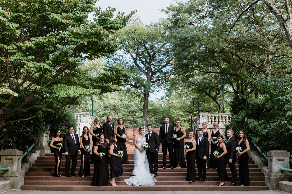 Wedding Party in Black Attire with White and Greenery Bouquets