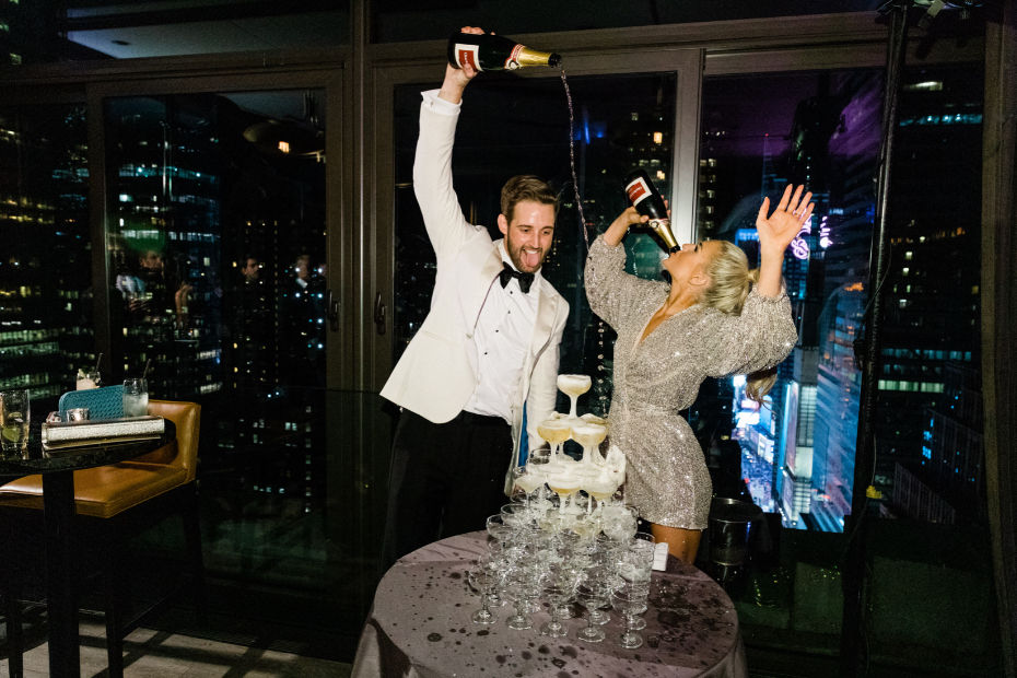 Bride and groom pouring champagne on champagne tour in NYC